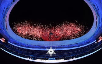 BEIJING, CHINA - MARCH 04: Fireworks are seen as the Olympic cauldron is lit during the Opening Ceremony of the Beijing 2022 Winter Paralympics at the Beijing National Stadium on March 04, 2022 in Beijing, China. (Photo by Ryan Pierse/Getty Images)