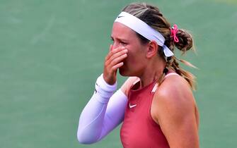 Victoria Azarenka of Belarus cries between points and before serving to Elena Rybakina of Kazakhstan during their Round 3 match at the Indian Wells tennis tournament on March 14, 2022 in Indian Wells, California. - Rybakina defeated Azarenka 6-3, 6-4. (Photo by Frederic J. BROWN / AFP) (Photo by FREDERIC J. BROWN/AFP via Getty Images)