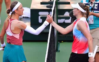 Elena Rybakina (R) of Kazakhstan and Victoria Azarenka of Belarus meet at the net following their Round 3 match at the Indian Wells tennis tournament on March 14, 2022 in Indian Wells, California. - Rybakina defeated Azarenka 6-3, 6-4. (Photo by Frederic J. BROWN / AFP) (Photo by FREDERIC J. BROWN/AFP via Getty Images)