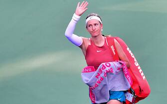 Victoria Azarenka of Belarus waves to the crowd after losing to Elena Rybakina of Kazakhstan following their Round 3 match at the Indian Wells tennis tournament on March 14, 2022 in Indian Wells, California. - Rybakina defeated Azarenka 6-3, 6-4. (Photo by Frederic J. BROWN / AFP) (Photo by FREDERIC J. BROWN/AFP via Getty Images)