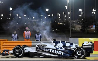 AlphaTauri's French driver Pierre Gasly's car is parked after catching fire during the Bahrain Formula One Grand Prix at the Bahrain International Circuit in the city of Sakhir on March 20, 2022. (Photo by Mazen MAHDI / AFP) (Photo by MAZEN MAHDI/AFP via Getty Images)