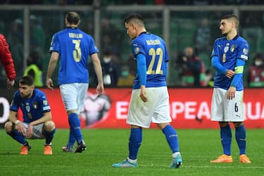 ItalyÕs players dejected at the end of the FIFA World Cup Qatar 2022 play-off qualifying soccer match between Italy and North Macedonia at the Renzo Barbera stadium in Palermo, Sicily island, Italy, 24 March 2022. ANSA/CARMELO IMBESI