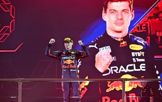 Red Bull's Dutch driver Max Verstappen celebrates on the podium after the 2022 Saudi Arabia Formula One Grand Prix at the Jeddah Corniche Circuit on March 27, 2022. (Photo by ANDREJ ISAKOVIC / AFP) (Photo by ANDREJ ISAKOVIC/AFP via Getty Images)