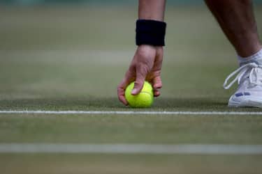 LONDON, ENGLAND - JULY 10:  A ball boy retreives a tennis ball on a grass court during the Wimbledon Lawn Tennis Championships at the All England Lawn Tennis and Croquet Club at Wimbledon on July 10, 2017 in London, England. (Photo by Tim Clayton/Corbis via Getty Images)
