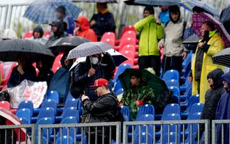 Fans shelter from the rain ahead of Practice 1 of the Emilia Romagna Grand Prix at the Autodromo Internazionale Enzo e Dino Ferrari circuit in Italy, better known as Imola. Picture date: Friday April 22, 2022. (Photo by David Davies/PA Images via Getty Images)
