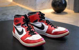 A pair of basketball legend Michael Jordan's famous Air Jordans from his rookie season are seen on April 28, 2021 in Geneva during a preview of sale by auction house Sothebys intitled «Gamers Only». - Jordan's sneakers are estimated to sell for 100,000 to 150,000 Swiss francs ($109,500-$164,000; 90,500-136,000 euros), but could go much higher following the buzz created by a new world record this week. (Photo by Fabrice COFFRINI / AFP) (Photo by FABRICE COFFRINI/AFP via Getty Images)