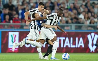 ROME, ITALY - MAY 11: Hakan Calhanoglu of FC Internazionale and Denis Zakaria of Juventus battle for the ball during the Coppa Italia Final match between Juventus and FC Internazionale at Stadio Olimpico on May 11, 2022 in Rome, Italy. (Photo by Matteo Ciambelli/vi/DeFodi Images via Getty Images)