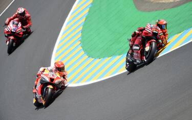 Ducati Lenovo Italian rider Francesco Bagnaia (R) rides ahead of Epsol Honda Spanish rider Marc Marquez during the second qualifying round ahead of the French Moto GP Grand Prix, at the Bugatti circuit in Le Mans, northwestern France, on May 14, 2022. (Photo by JEAN-FRANCOIS MONIER / AFP) (Photo by JEAN-FRANCOIS MONIER/AFP via Getty Images)