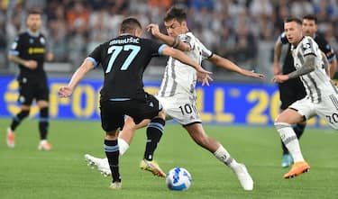 Juventus  Paulo Dybala  and Lazio s Adam Marusic in action during the italian Serie A soccer match Juventus FC vs SS Lazio at the Allianz Stadium in Turin, Italy, 16 may 2022 ANSA/ALESSANDRO DI MARCO