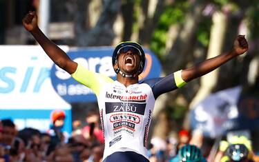 Team Wanty's Eritrean rider Biniam Girmay Hailu celebrates as he crosses the finish line to win the 10th stage of the Giro d'Italia 2022 cycling race, 196 kilometers between Pescara and Jesi, central Italy, on May 17, 2022. (Photo by Luca Bettini / AFP) (Photo by LUCA BETTINI/AFP via Getty Images)