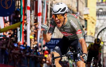 Team Alpecin-Fenix Italian rider Stefano Oldani celebrates as he crosses the finish line to win the 12th stage of the Giro d'Italia 2022 cycling race, 204 kilometers from Parma to Genova, on May 19, 2022. (Photo by Luca Bettini / AFP) (Photo by LUCA BETTINI/AFP via Getty Images)