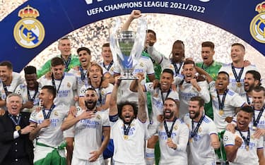 Real Madrid's Brazilian defender Marcelo lifts the Champions League trophy after Madrid 's victory in the UEFA Champions League final football match between Liverpool and Real Madrid at the Stade de France in Saint-Denis, north of Paris, on May 28, 2022. (Photo by Paul ELLIS / AFP) (Photo by PAUL ELLIS/AFP via Getty Images)