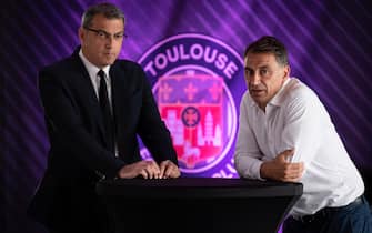 New Toulouse Football Club (TFC) President Damien Comolli (L) and former TFC President Olivier Sadran pose during a joint press conference on July 22, 2020, at the Stadium de Toulouse in Toulouse, southern France. - American investment firm RedBird Capital Partners on July 20 completed the takeover of Toulouse Football Club, who have been relegated to the second tier Ligue 2 after finishing bottom of Ligue 1 in the coronavirus-abbreviated French football season. RedBird Capital Partners bought 85 percent of the club and appointed much-travelled French football executive Damien Comolli as president. Outgoing president Olivier Sadran retained a 15 percent stake in the club. (Photo by Lionel BONAVENTURE / AFP) (Photo by LIONEL BONAVENTURE/AFP via Getty Images)