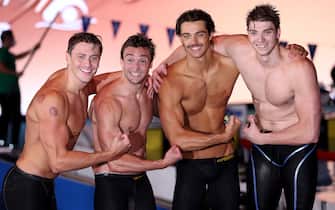 BUDAPEST, HUNGARY - JUNE 25: Nicholas Martinenghi, Federico Burdisso, Thomas Ceccon and Alessandro Miressi of Team Italy celebrate after picking up Gold in the Men's 4x100m Medley Relay Final on day eight of the Budapest 2022 FINA World Championships at Duna Arena on June 25, 2022 in Budapest, Hungary. (Photo by Tom Pennington/Getty Images)