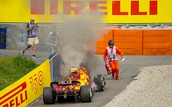 07/10/2022, Red Bull Ring , Spielberg, Formula 1 BWT Grand Prix of Austria 2022 , in the picture Carlos Sainz Jr. (ESP), Scuderia Ferrari gets out of his burning Ferrari.