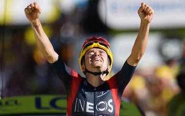 Ineos Grenadiers team's British rider Thomas Pidcock celebrates as he cycles past the finish line to win the 12th stage of the 109th edition of the Tour de France cycling race, 165,1 km between Briancon and L'Alpe-d'Huez, in the French Alps, on July 14, 2022. (Photo by Thomas SAMSON / AFP) (Photo by THOMAS SAMSON/AFP via Getty Images)