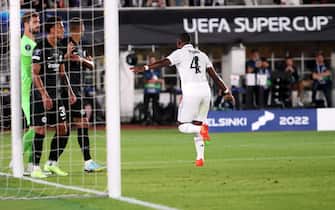 epa10114710 David Alaba of Real Madrid scores the 1-0  during the UEFA Super Cup soccer match between Real Madrid and Eintracht Frankfurt at the Olympic Stadium in Helsinki, Finland, 10 August 2022.  EPA/Petteri Paalasmaa