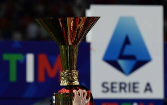 AC Milan's players celebrate with the winner's trophy after AC Milan won the Italian Serie A football match between Sassuolo and AC Milan, securing the "Scudetto" championship on May 22, 2022 at the Mapei - Citta del Tricolore stadium in Sassuolo. (Photo by Filippo MONTEFORTE / AFP) (Photo by FILIPPO MONTEFORTE/AFP via Getty Images)