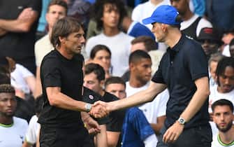 Tottenham Hotspur's Italian head coach Antonio Conte (L) and Chelsea's German head coach Thomas Tuchel (R) shake hands after the English Premier League football match between Chelsea and Tottenham Hotspur at Stamford Bridge in London on August 14, 2022. - The game finished 2-2. - RESTRICTED TO EDITORIAL USE. No use with unauthorized audio, video, data, fixture lists, club/league logos or 'live' services. Online in-match use limited to 120 images. An additional 40 images may be used in extra time. No video emulation. Social media in-match use limited to 120 images. An additional 40 images may be used in extra time. No use in betting publications, games or single club/league/player publications. (Photo by Glyn KIRK / AFP) / RESTRICTED TO EDITORIAL USE. No use with unauthorized audio, video, data, fixture lists, club/league logos or 'live' services. Online in-match use limited to 120 images. An additional 40 images may be used in extra time. No video emulation. Social media in-match use limited to 120 images. An additional 40 images may be used in extra time. No use in betting publications, games or single club/league/player publications. / RESTRICTED TO EDITORIAL USE. No use with unauthorized audio, video, data, fixture lists, club/league logos or 'live' services. Online in-match use limited to 120 images. An additional 40 images may be used in extra time. No video emulation. Social media in-match use limited to 120 images. An additional 40 images may be used in extra time. No use in betting publications, games or single club/league/player publications. (Photo by GLYN KIRK/AFP via Getty Images)