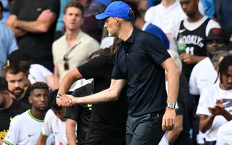 Tottenham Hotspur's Italian head coach Antonio Conte (L) and Chelsea's German head coach Thomas Tuchel (R) shake hands after the English Premier League football match between Chelsea and Tottenham Hotspur at Stamford Bridge in London on August 14, 2022. - The game finished 2-2. - RESTRICTED TO EDITORIAL USE. No use with unauthorized audio, video, data, fixture lists, club/league logos or 'live' services. Online in-match use limited to 120 images. An additional 40 images may be used in extra time. No video emulation. Social media in-match use limited to 120 images. An additional 40 images may be used in extra time. No use in betting publications, games or single club/league/player publications. (Photo by Glyn KIRK / AFP) / RESTRICTED TO EDITORIAL USE. No use with unauthorized audio, video, data, fixture lists, club/league logos or 'live' services. Online in-match use limited to 120 images. An additional 40 images may be used in extra time. No video emulation. Social media in-match use limited to 120 images. An additional 40 images may be used in extra time. No use in betting publications, games or single club/league/player publications. / RESTRICTED TO EDITORIAL USE. No use with unauthorized audio, video, data, fixture lists, club/league logos or 'live' services. Online in-match use limited to 120 images. An additional 40 images may be used in extra time. No video emulation. Social media in-match use limited to 120 images. An additional 40 images may be used in extra time. No use in betting publications, games or single club/league/player publications. (Photo by GLYN KIRK/AFP via Getty Images)