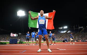 MUNICH, GERMANY - AUGUST 16: Gold medalist Lamont Marcell Jacobs of Italy celebrates after the Athletics - Men's 100m Final on day 6 of the European Championships Munich 2022 at Olympiapark on August 16, 2022 in Munich, Germany. (Photo by Matthias Hangst/Getty Images)