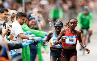 NEW YORK, NEW YORK - NOVEMBER 06: Sharon Lokedi of Kenya grabs a cup of water while competing in the Women's Professional Division of the TCS New York City Marathon on November 06, 2022 in New York City. (Photo by Sarah Stier/Getty Images)
