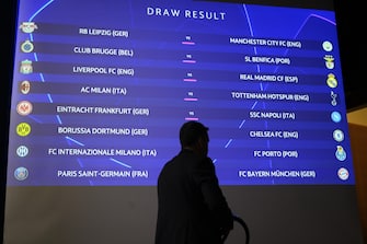 epa10292030 The match fixtures are shown on an electronic panel during the UEFA Champions League 2022/23 round of 16 draw, at the UEFA Headquarters in Nyon, Switzerland, 07 November.  EPA/LAURENT GILLIERON