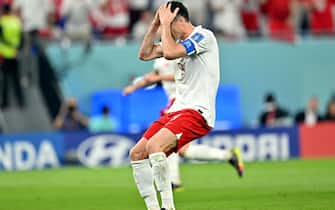 epa10321024 Robert Lewandowski of Poland reacts after failing to score by penalty during the FIFA World Cup 2022 group C soccer match between Mexico and Poland at Stadium 947 in Doha, Qatar, 22 November 2022.  EPA/Noushad Thekkayil