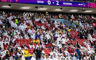 20 November 2022, Qatar, Al-Khor: Soccer, World Cup 2022 in Qatar, Qatar - Ecuador, Preliminary round, Group A, Matchday 1, Opening match at Al-Bait Stadium. Fans leave the stadium before the end of the match. The stands are no longer full. Photo: Tom Weller/dpa (Photo by Tom Weller/picture alliance via Getty Images)