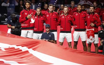 epa10332158 Canada's team players listen to the national anthem prior to the Davis Cup final between Canada and Australia in Malaga, Andalusia, southern Spain, 27 November 2022.  EPA/JORGE ZAPATA