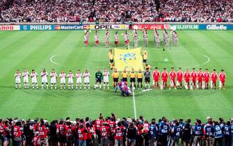 LYON, FRANCE - JUNE 21: Iran and USA soccer teams line up before the World Cup 1st round match between USA (1) and Iran (2) at the Parc Olympique on June 21, 1998 in Lyon, France. (Photo by Simon Bruty/Anychance/Getty Images)