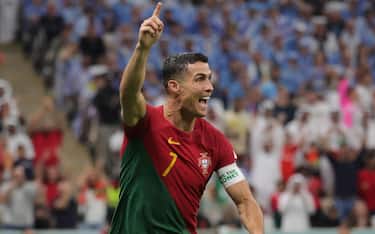 epa10335298 Cristiano Ronaldo of Portugal celebrates after scoring the 1-0 during the FIFA World Cup 2022 group H soccer match between Portugal and Uruguay at Lusail Stadium in Lusail, Qatar, 28 November 2022.  EPA/Abir Sultan