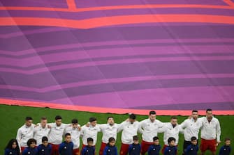 Spain's players listen to the national anthems ahead of the Qatar 2022 World Cup Group E football match between Spain and Germany at the Al-Bayt Stadium in Al Khor, north of Doha on November 27, 2022. (Photo by NICOLAS TUCAT / AFP) (Photo by NICOLAS TUCAT/AFP via Getty Images)