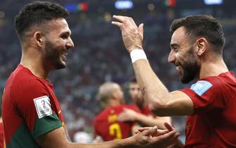 epa10352597 Goncalo Ramos (L) of Portugal celebrates with teammate Andre Silva after scoring the opening goal during the FIFA World Cup 2022 round of 16 soccer match between Portugal and Switzerland at Lusail Stadium in Lusail, Qatar, 06 December 2022.  EPA/Rolex dela Pena
