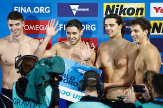 MELBOURNE, AUSTRALIA - DECEMBER 13: Alessandro Miressi, Leonardo Deplano, Thomas Ceccon and Paolo Conte Bonin of Italy celebrate winning gold in the Menâ  s 4x100m Freestyle Final, setting a new world record in a time of 3:02.75 on day one of the 2022 FINA World Short Course Swimming Championships at Melbourne Sports and Aquatic Centre on December 13, 2022 in Melbourne, Australia. (Photo by Daniel Pockett/Getty Images)