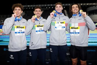 MELBOURNE, AUSTRALIA - DECEMBER 13: Gold medallists Alessandro Miressi, Leonardo Deplano, Thomas Ceccon and Paolo Conte Bonin of Italy pose during the medal ceremony for the Menâ  s 4x100m Freestyle Final on day one of the 2022 FINA World Short Course Swimming Championships at Melbourne Sports and Aquatic Centre on December 13, 2022 in Melbourne, Australia. (Photo by Daniel Pockett/Getty Images)