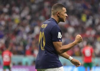 epa10366193 Kylian Mbappe of France celebrates the 2-0 lead during the FIFA World Cup 2022 semi final between France and Morocco at Al Bayt Stadium in Al Khor, Qatar, 14 December 2022.  EPA/Friedemann Vogel