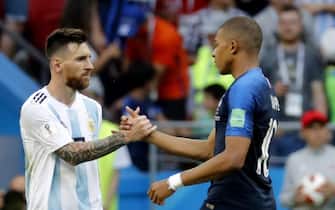 epa06852417 Lionel Messi (L) of Argentina shakes hands with Kylian Mbappe of France after the FIFA World Cup 2018 round of 16 soccer match between France and Argentina in Kazan, Russia, 30 June 2018.

(RESTRICTIONS APPLY: Editorial Use Only, not used in association with any commercial entity - Images must not be used in any form of alert service or push service of any kind including via mobile alert services, downloads to mobile devices or MMS messaging - Images must appear as still images and must not emulate match action video footage - No alteration is made to, and no text or image is superimposed over, any published image which: (a) intentionally obscures or removes a sponsor identification image; or (b) adds or overlays the commercial identification of any third party which is not officially associated with the FIFA World Cup)  EPA/FELIPE TRUEBA   EDITORIAL USE ONLY