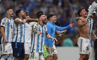 epa10372851 Lionel Messi (C) of Argentina celebrates with teammates after winning the FIFA World Cup 2022 Final between Argentina and France at Lusail stadium, Lusail, Qatar, 18 December 2022.  EPA/Tolga Bozoglu