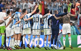 epa10364502 Lionel Messi (C) of Argentina celebrates with teammates after winning the FIFA World Cup 2022 semi final between Argentina and Croatia at Lusail Stadium in Lusail, Qatar, 13 December 2022.  EPA/Noushad Thekkayil