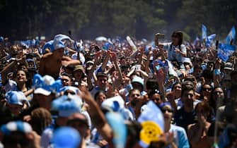 Fans of Argentina react while watching the live broadcast of the Qatar 2022 World Cup final football match between Argentina and France in Buenos Aires, on December 18, 2022. (Photo by LUIS ROBAYO / AFP) (Photo by LUIS ROBAYO/AFP via Getty Images)
