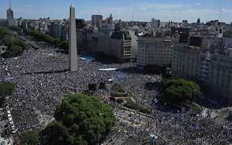 In this aerial view fans of Argentina gather at the Obelisk to celebrate winning the Qatar 2022 World Cup against France in Buenos Aires, on December 18, 2022. (Photo by Luis ROBAYO / AFP) (Photo by LUIS ROBAYO/AFP via Getty Images)