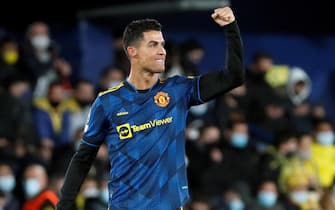 epaselect epa09599460 Manchester United's Cristiano Ronaldo celebrates after scoring the 0-1 goal during the UEFA Champions League group F between Villarreal CF and Manchester United at La Ceramica stadium in Vila-real, eastern Spain, 23 November 2021.  EPA/Biel Alino