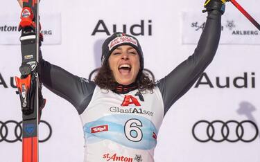 epa10404628 Winner Federica Brignone of Italy celebrates on the podium after the women's Super G race at the FIS Alpine Skiing World Cup in St. Anton am Arlberg, Austria, 14 January 2023.  EPA/CHRISTIAN BRUNA