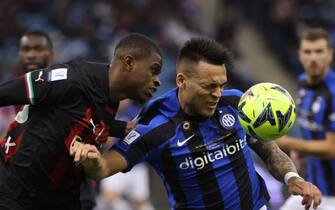 AC Milan's French defender Pierre Kalulu (L) fights for the ball with Inter Milan's Argentinian forward Lautaro Martinez during the Italian SuperCup football match between AC Milan and Inter Milan, at the King Fahd International Stadium in Riyadh on January 18, 2023. (Photo by Giuseppe CACACE / AFP) (Photo by GIUSEPPE CACACE/AFP via Getty Images)