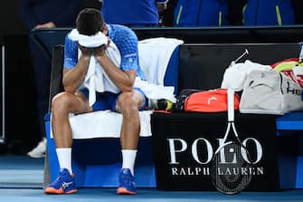 epa10438093 Novak Djokovic of Serbia reacts after winning the Men s Singles Final against Stefanos Tsitsipas of Greece at the 2023 Australian Open tennis tournament in Melbourne, Australia, 29 January 2023.  EPA/JOEL CARRETT AUSTRALIA AND NEW ZEALAND OUT