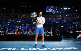 Serbia's Novak Djokovic celebrates with the Norman Brookes Challenge Cup trophy following his victory against Greece's Stefanos Tsitsipas in the men's singles final match on day fourteen of the Australian Open tennis tournament in Melbourne on January 29, 2023. - -- IMAGE RESTRICTED TO EDITORIAL USE - STRICTLY NO COMMERCIAL USE -- (Photo by Manan VATSYAYANA / AFP) / -- IMAGE RESTRICTED TO EDITORIAL USE - STRICTLY NO COMMERCIAL USE -- (Photo by MANAN VATSYAYANA/AFP via Getty Images)