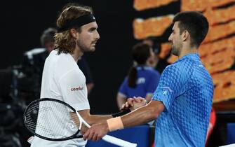Serbia's Novak Djokovic greets Greece's Stefanos Tsitsipas after his victory during the men's singles final on day fourteen of the Australian Open tennis tournament in Melbourne on January 29, 2023. - -- IMAGE RESTRICTED TO EDITORIAL USE - STRICTLY NO COMMERCIAL USE -- (Photo by DAVID GRAY / AFP) / -- IMAGE RESTRICTED TO EDITORIAL USE - STRICTLY NO COMMERCIAL USE -- (Photo by DAVID GRAY/AFP via Getty Images)