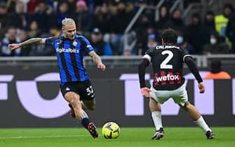 MILAN, ITALY - FEBRUARY 05: Federico Dimarco of FC Internazionale, in action, kicks the ball during the Serie A match between FC Internazionale and AC MIlan at Stadio Giuseppe Meazza on February 05, 2023 in Milan, Italy. (Photo by Mattia Ozbot - Inter/Inter via Getty Images)