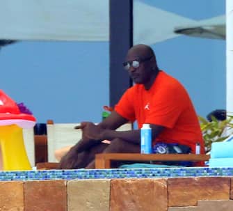 Basketball Legend Michael Jordan Relaxes With A Cigar During Vacation In Cabo San Lucas  With Wife Yvette Prieto And Pals.  The 58-year-old former pro athlete kicked back at a luxury oceanfront resort on Friday wearing one of his famous Air Jordan T-shirts. Former model Yvette, 42, showed off her figure in an emerald bikini  as they soaked up the sun on their terrace with friends.



Pictured: Michael Jordan

Ref: SPL5236064 020721 NON-EXCLUSIVE

Picture by: SplashNews.com



Splash News and Pictures

USA: +1 310-525-5808
London: +44 (0)20 8126 1009
Berlin: +49 175 3764 166

photodesk@splashnews.com



World Rights,